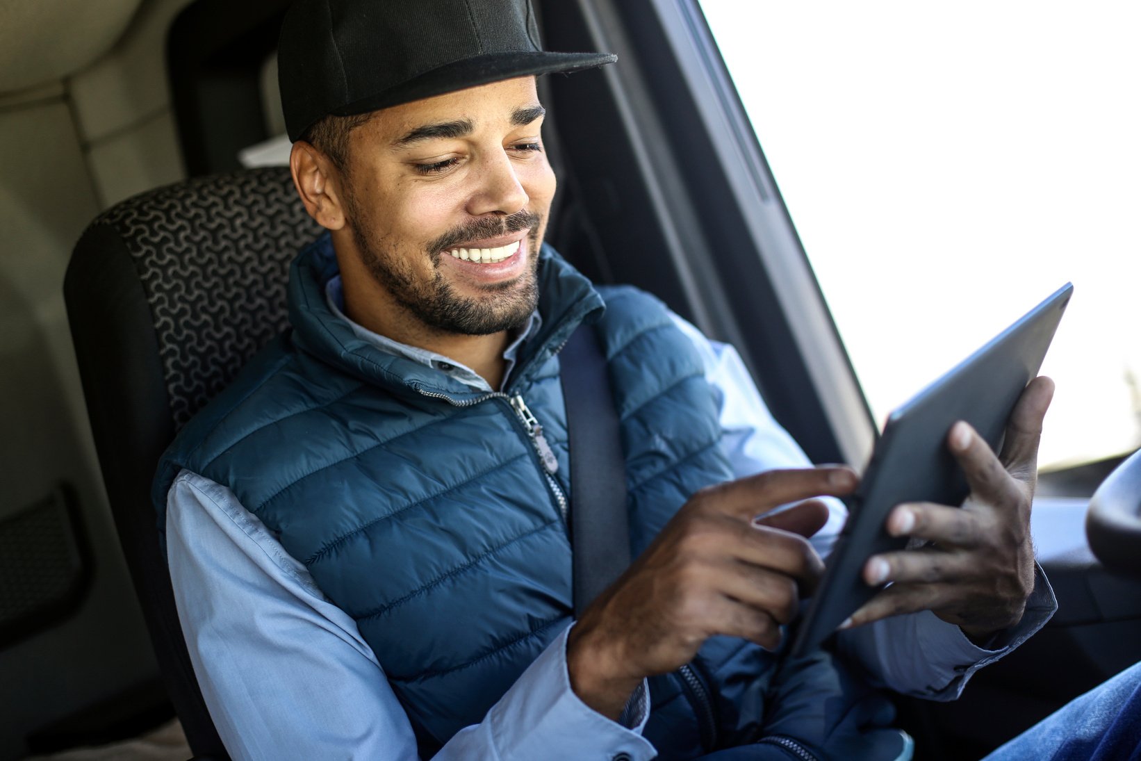 Truck driver using a tablet